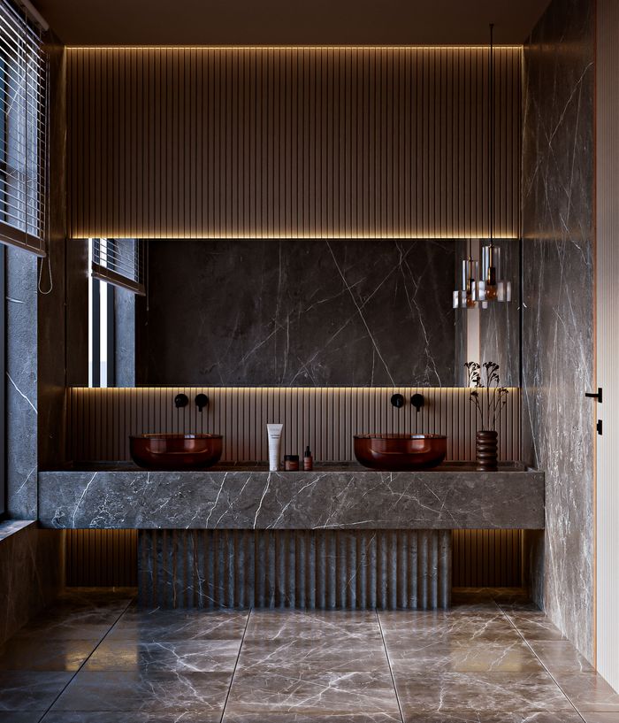 services-05 Elegant modern bathroom with marble design, double sink, and ambient warm lighting.