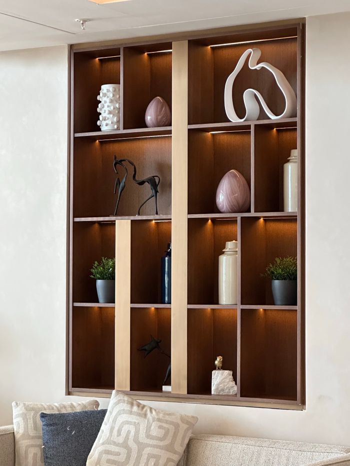 Crafting Captivating Headlines: Your awesome post title goes here Stylish wooden wall shelf with decor items in a modern living room.